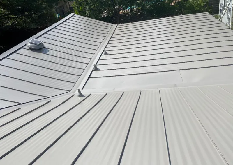 Solar attic fan installed on a metal roof for Roof Ventilation in Kailua
