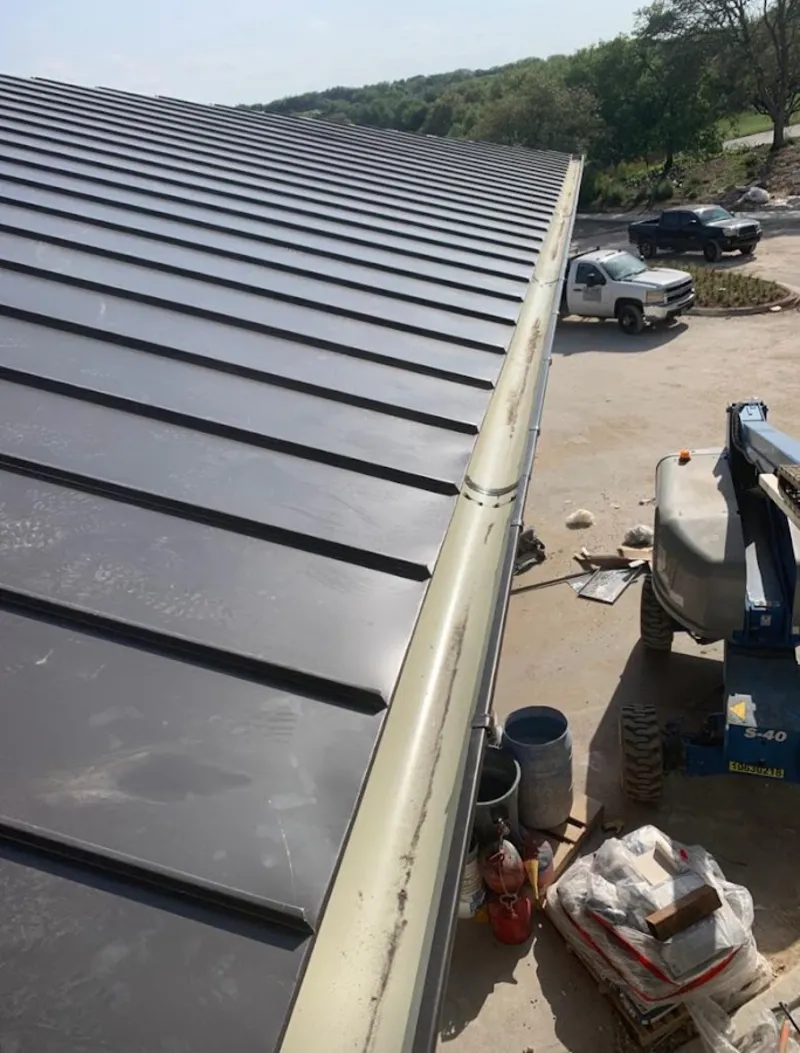 Standing seam panel and gutter detail on a metal roofing jobsite in Kailua